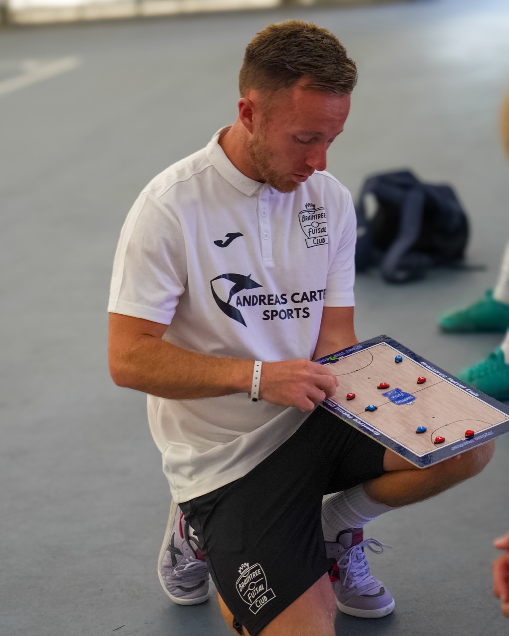 Jack Harrod explaining a session with his tactics board.