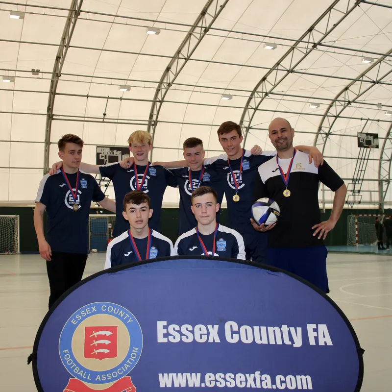 Braintree’s U16 players and coach celebrating the 2022 Essex title